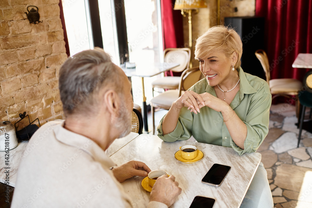 Romantic moments shared by a mature couple at a cozy cafe in the afternoon light