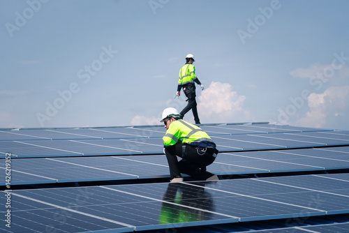 Engineer team installs solar cells check installation solar cell on the roof Sustainable energy industry concept Renewable energy solutions for climate change..