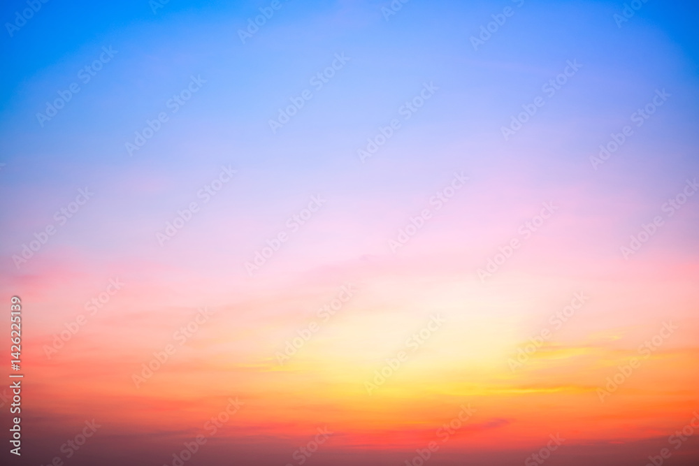 Obraz premium Beautiful , luxury soft gradient orange gold clouds and sunlight on the blue sky perfect for the background, take in evening,Twilight, Large size, high definition landscape photo