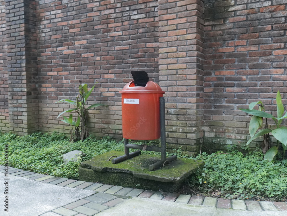 red brick wall with trash can red brick wall with trash can