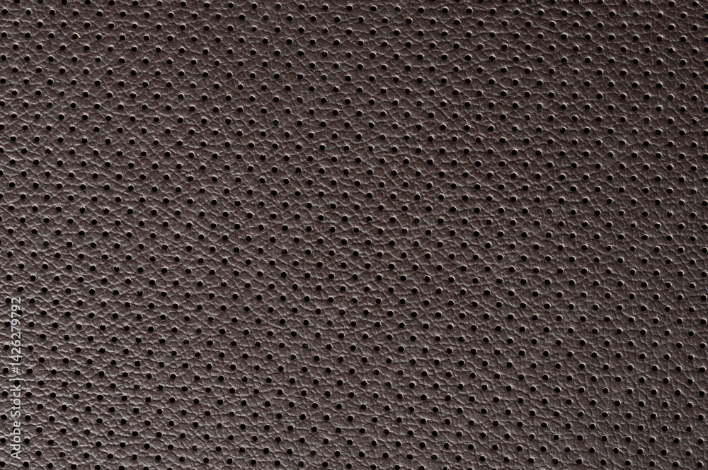 Close up of perforated brown leather