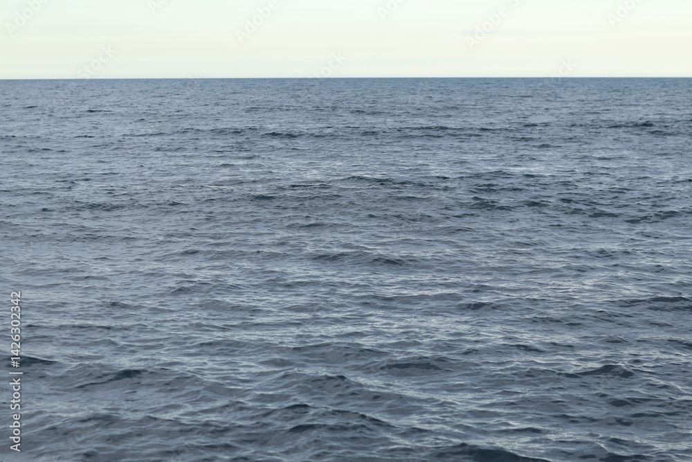 Obraz premium Adriatic sea. Nature background. Space. Sea with small waves, ripples on the water. Water surface with small waves. Background. Horizon