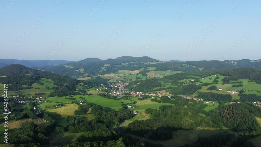 The Alsatian countryside thrives between woods and a typical village, in Europe, in France, in Alsace, in the Bas Rhin, near Strasbourg, in summer, on a sunny day. The Alsatian countryside thrives between woods and a typical village, in Europe, in France, in Alsace, in the Bas Rhin, near Strasbourg, in summer, on a sunny day.