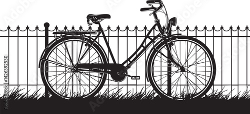 Black and white silhouette of a bicycle parked against a metal fence with grass beneath