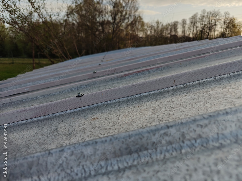 Screw with insulation on sheet metal.