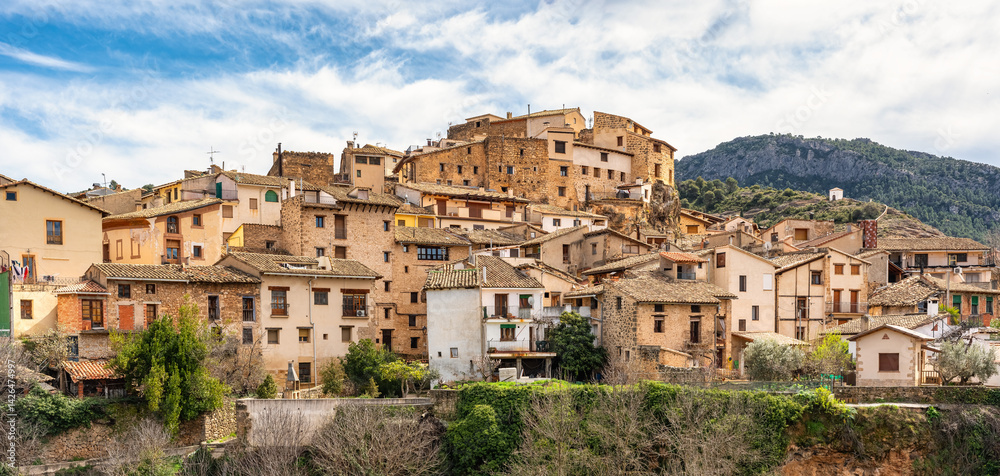 Panoramic view of the town of Beceite with its old stone houses next to the mountain, Aragon.