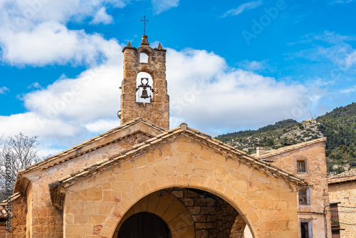 Obraz na płótnie Old stone church with bell tower in the beautiful town of Beceite, Teruel, w salonie