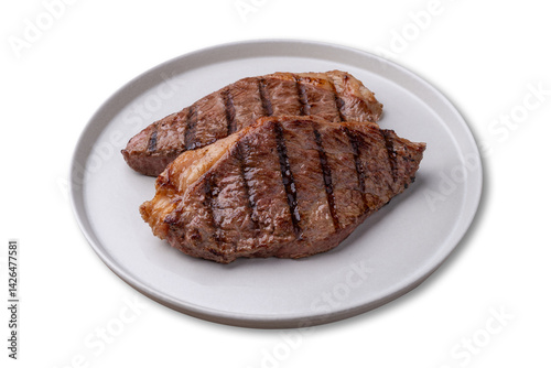 Grilled picanha beefs in a plate isolated over white background