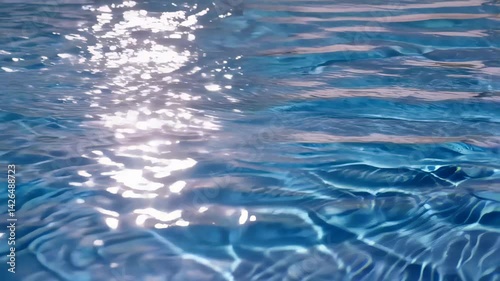Gently moving water with light patterns and sun glare creates a peaceful and soothing visual of relaxation and nature Concept of tranquility and the calming effect of water in motion photo