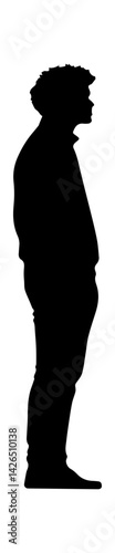 Silhouette of a young man standing in profile, showcasing a contemplative mood and distinct hairstyle.
