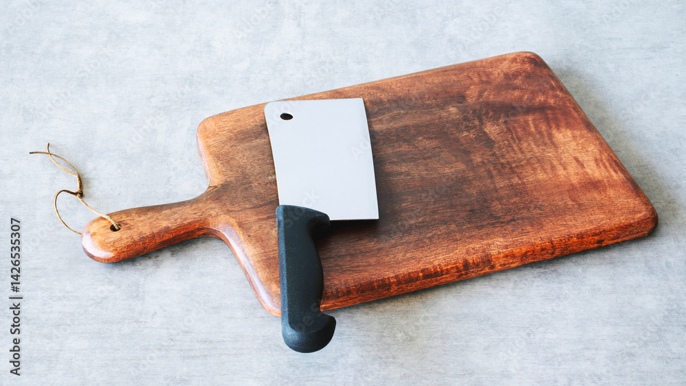 Fototapeta premium Wooden cutting board on background