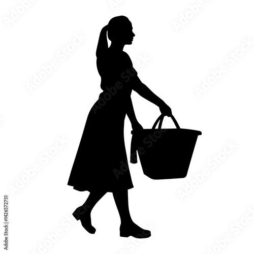 Silhouette of a woman carrying a basket while walking  