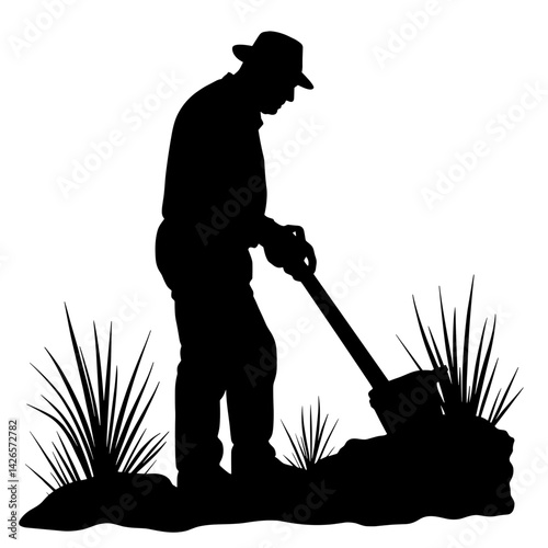 Silhouette of a gardener digging with a shovel against grass  