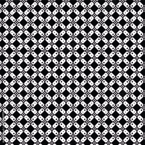 Geometric maze of white motifs on black ground evokes a complex patterned puzzle