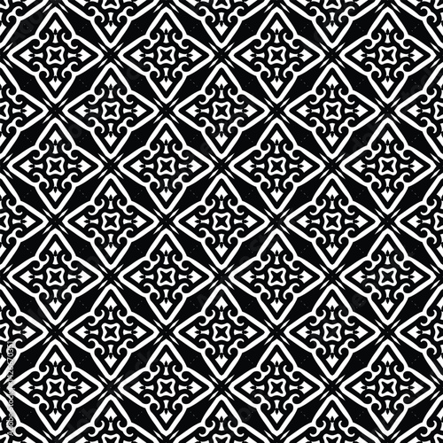 Geometric pattern of ornate diamond shapes in black and white