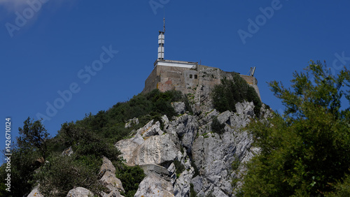 Fortress guarding the Rock of Gibraltar under clear blue sky - GIBRALTAR, UK - MARCH 31, 2025