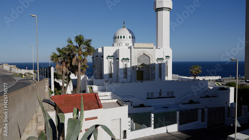 King Fahad Bin Abdul Aziz Al Saud Mosque shining under blue sky - GIBRALTAR, UK - MARCH 31, 2025