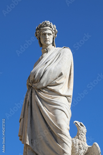 statue of famous writer DANTE ALIGHIERI who wrote the Divine Comedy a story of a man who from hell reaches heaven through purgatory and an eagle below photo