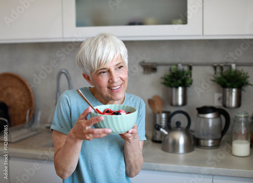 kitchen food woman healthy morning mature breakfast active fitness diet home healthy eating senior adult healthy lifestyle fruit sport fit health eating preparation nutrition female