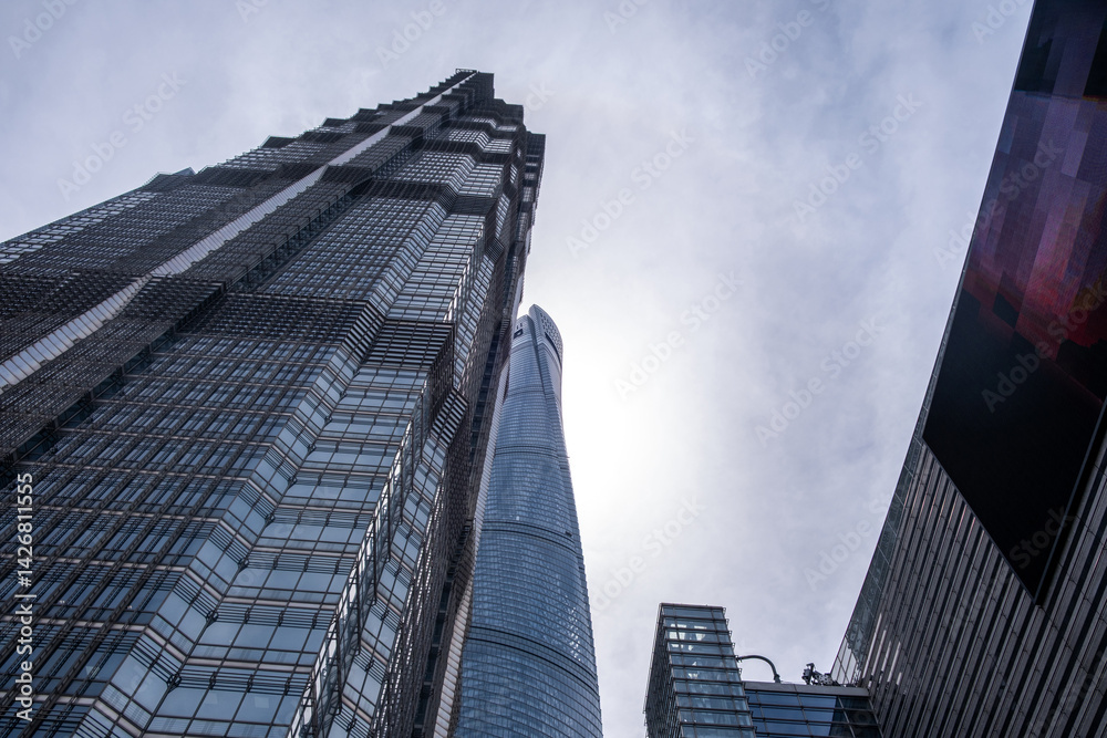Shanghai city buildings against blue sky, High rise business offices, low angle