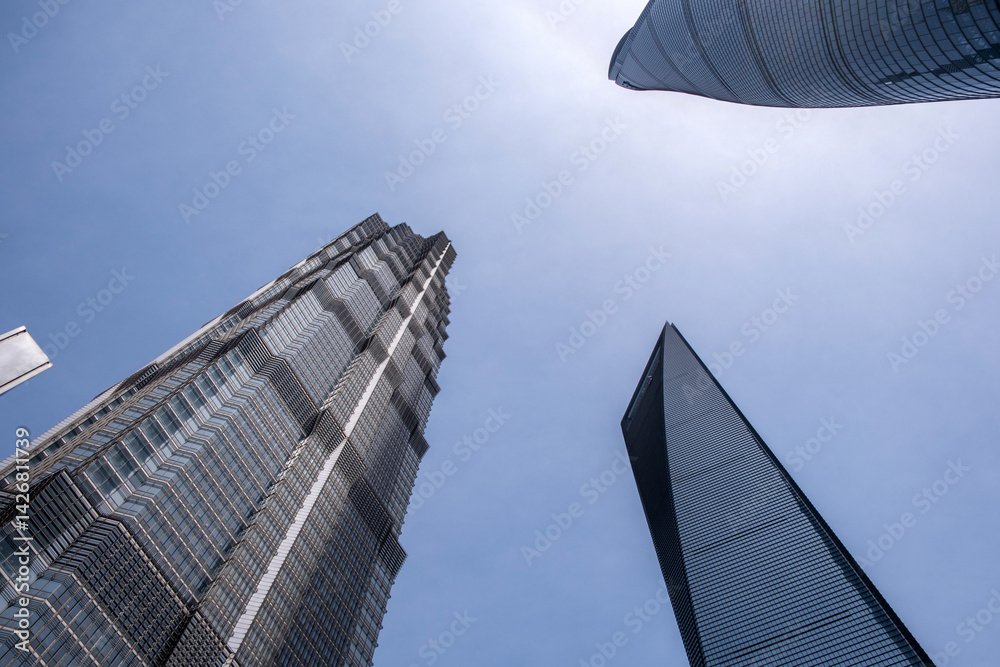 Shanghai city buildings against blue sky, High rise business offices, low angle