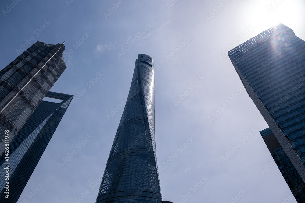 Shanghai city buildings against blue sky, High rise business offices, low angle