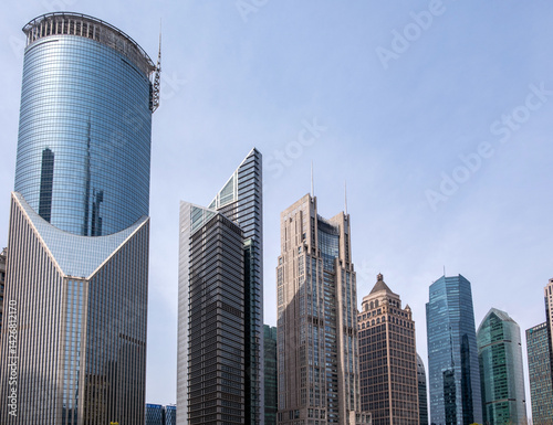 Obraz na płótnie Shanghai, China, city buildings. Modern skyscrapers against blue sky, high rise glass office business towers w salonie