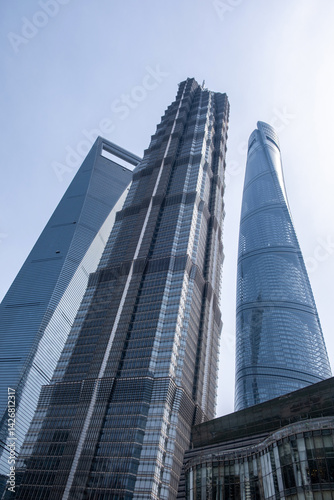 Obraz na płótnie Shanghai, China, city buildings. Modern skyscrapers against blue sky, high rise glass office business towers w salonie