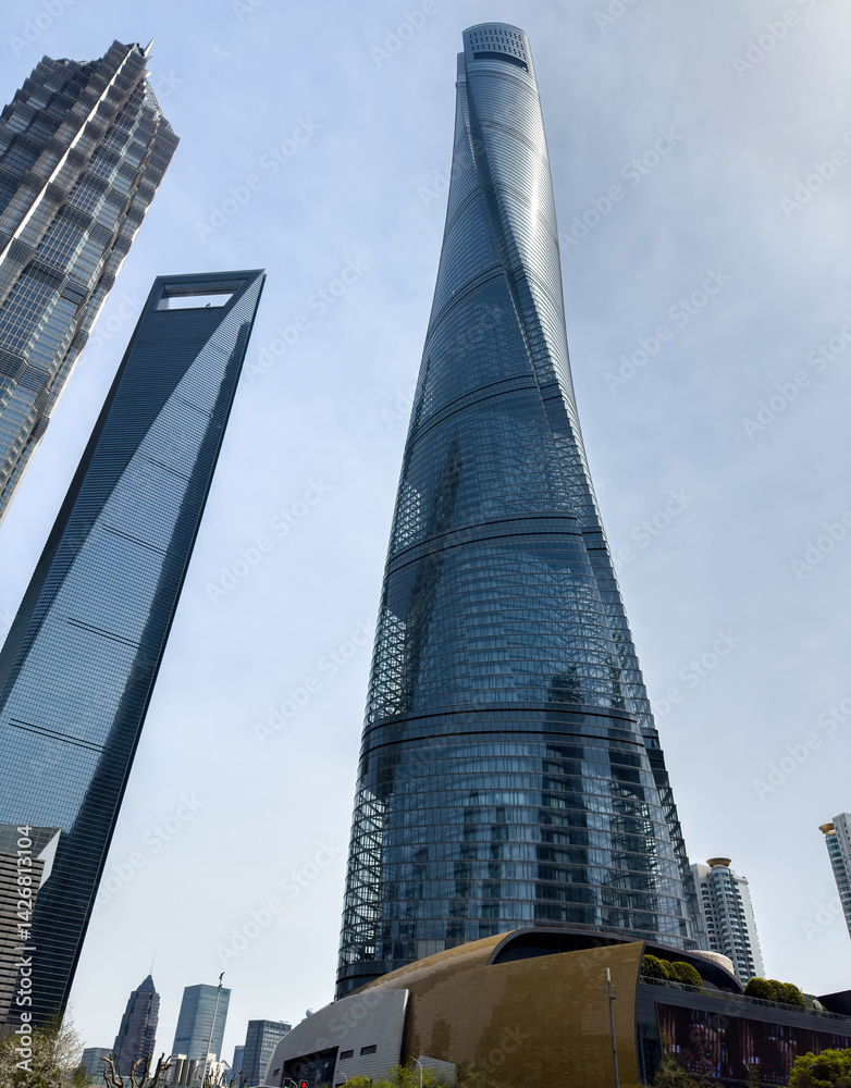 Shanghai city high rise buildings against blue sky, China. Business skyscrapers low angle view.