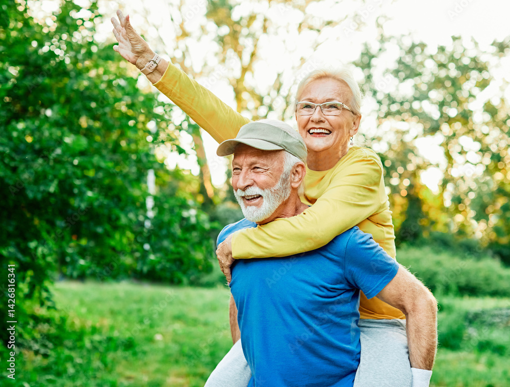 outdoor senior fitness woman man love active fun piggyback exercise healthy fit sport retirement happy adult couple mature exercising nature activity old elderly wife husband embracing