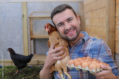 Man holding bio egss and a cute hen  photo