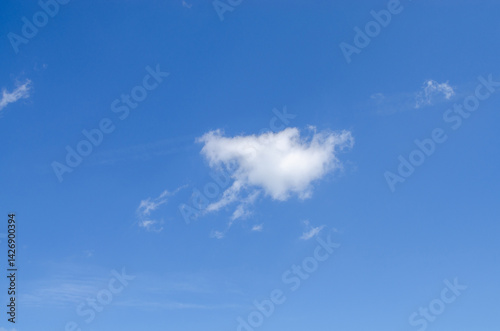 Obraz na płótnie White irregular clouds against a blue beautiful sky in summer w salonie