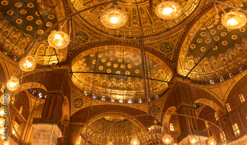 Display the Cairo citadel illumination in Mohammed Ali Mosque interior, showcasing alabaster art. Perfect for illustrating the beauty of Islamic architecture.