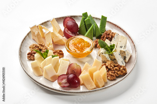 Obraz na płótnie Plate of gourmet cheeses with walnuts, grapes and orange jam w salonie