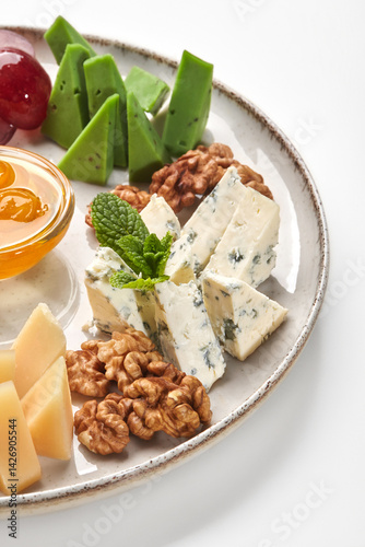 Obraz na płótnie Plate presenting delicious cheese selection with honey and walnuts w salonie