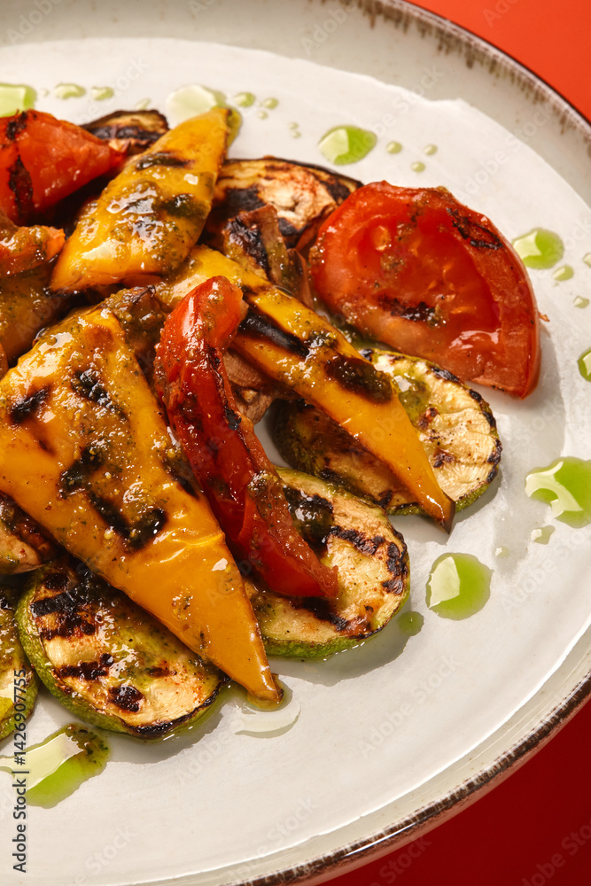 Delicious grilled vegetables with pesto sauce, creating a healthy and flavorful meal