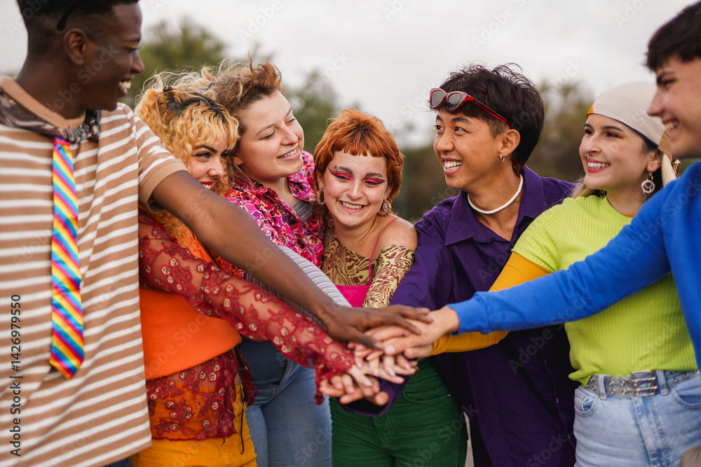 Group of multiracial young people stacking hands outdoor - Diverse students, party and city concept - Focus on redhead woman face Group of multiracial young people stacking hands outdoor - Diverse students, party and city concept - Focus on redhead woman face