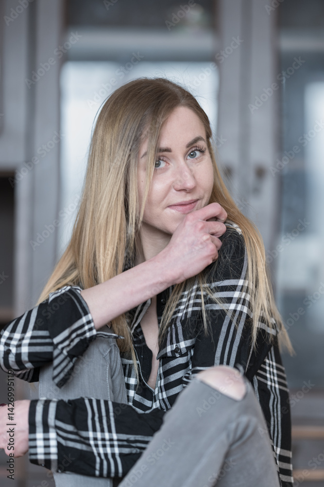 Fototapeta premium Confident Female with Long Hair in Black and White Shirt Indoors