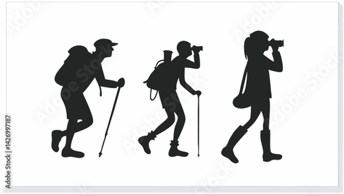 Silhouetted hiking team with backpacks and cameras walking together on adventure trip