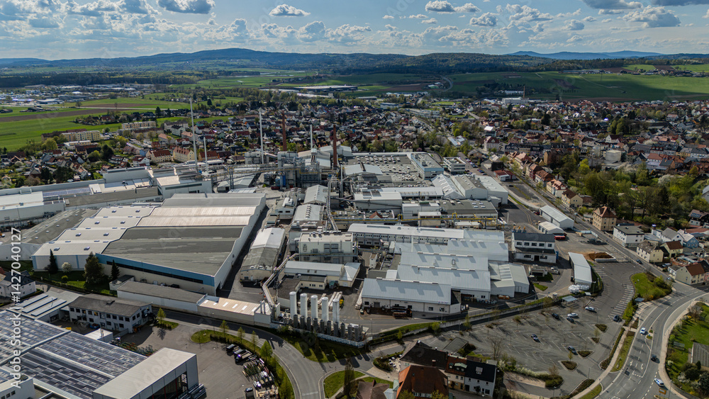 Panoramic view of a town with a large industrial complex Panoramic view of a town with a large industrial complex