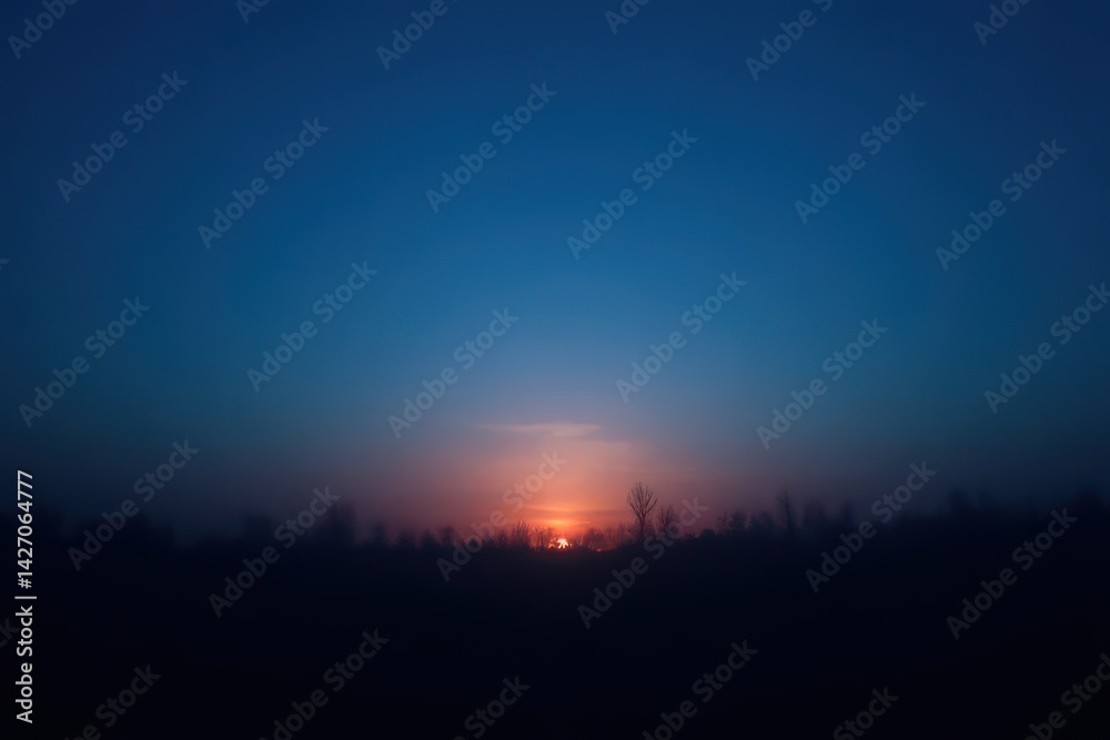 Moody After-Sunset Scene: Fading Blue Sky, Soft Glow Horizon, Quiet Silhouettes Moody After-Sunset Scene: Fading Blue Sky, Soft Glow Horizon, Quiet Silhouettes