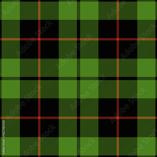 Green and red tartan plaid. Scottish pattern fabric swatch close-up. 