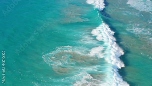 Obraz na płótnie Aerial view showing coral and sandy sea bottom, with ocean water above. Natural beauty under the sea. w salonie