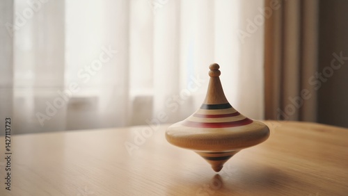 This is a charming wooden spindle, also known as a whirligig or spinning top, often found at carousels and fairgrounds. The colors are bright and include red, yellow, green, blue, and white.