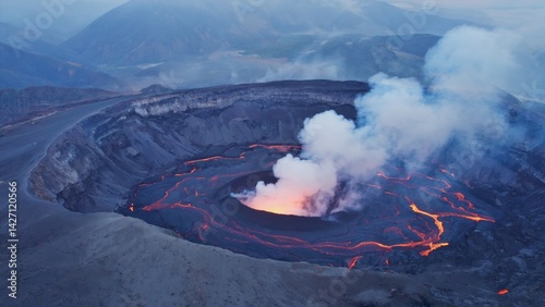 Obraz na płótnie Majestic crater of an active volcano with visible lava flowing down its sides. w salonie