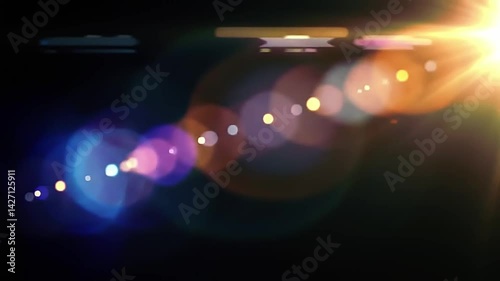 Colorful lens flare moving slowly across frame fade out