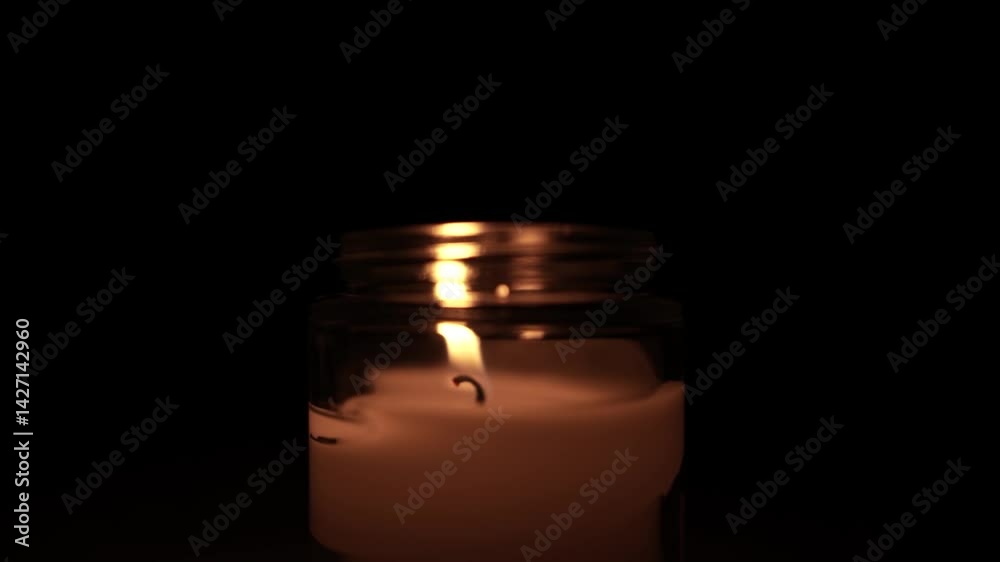 Candle Lit in Darkness with Soft Glow Candle Lit in Darkness with Soft Glow