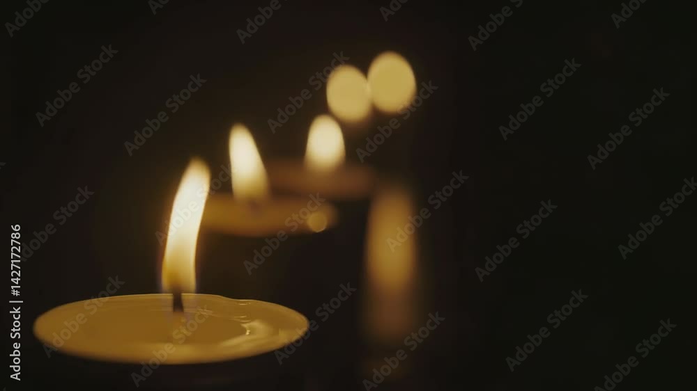Soft candlelight flickering against dark background, creating warm, mesmerizing glow with gentle illumination and serene ambience Soft candlelight flickering against dark background, creating warm, mesmerizing glow with gentle illumination and serene ambience
