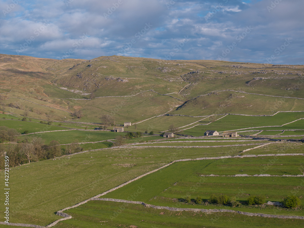 Idyllic Landscape View of the Yorkshire Dales and Traditional Stone Barns Idyllic Landscape View of the Yorkshire Dales and Traditional Stone Barns