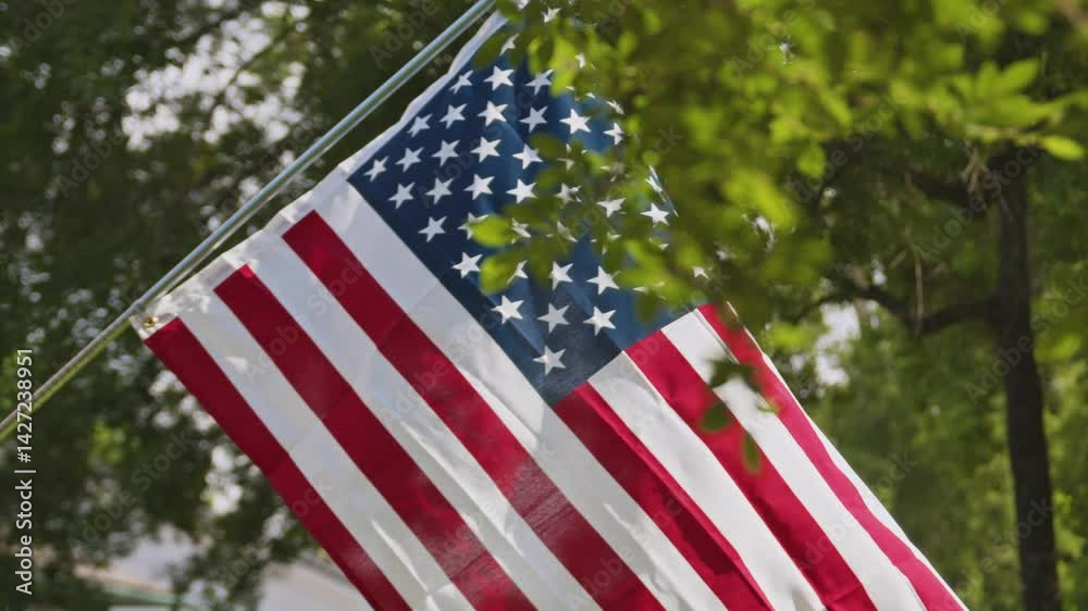 American Flag Flies in a Backyard on a Windy Day Slomo